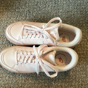 Soft pink Nike platform shoes